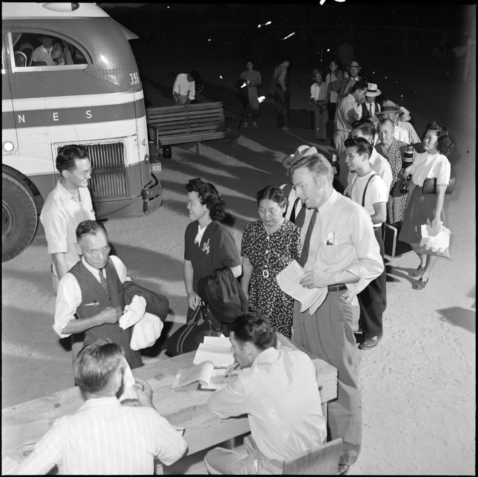 Gila River Relocation Center, Rivers Arizona. Relocators being checked by Leave Officers before boa . . . - NARA - 539830