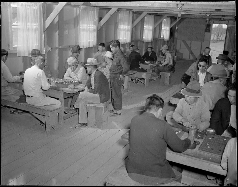 Gila River Relocation Center, Rivers, Arizona. A general view in the recreation hall of a group of . . . - NARA - 538631