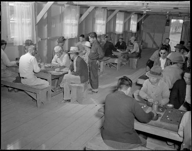 Gila River Relocation Center, Rivers, Arizona. A general view in the recreation hall of a group of . . . - NARA - 538631