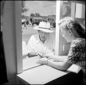 Gila River Relocation Center, Rivers, Arizona. A relocator receiving travel grant from Billie J. Fr . . . - NARA - 539833
