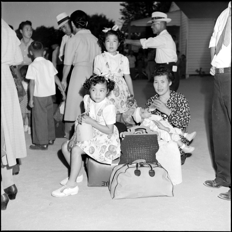 Gila River Relocation Center, Rivers, Arizona. Center residents awaiting the arrival of the bus whi . . . - NARA - 539847