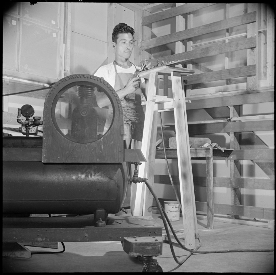 Gila River Relocation Center, Rivers, Arizona. Errol Ishii, foreman of the model ship plant at the . . . - NARA - 537097
