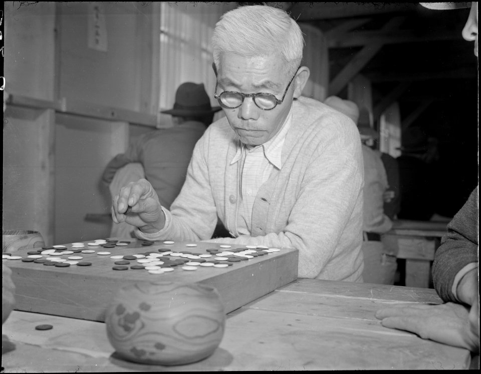 Gila River Relocation Center, Rivers, Arizona. An evacuee of Japanese ancestry contemplates a move . . . - NARA - 538653