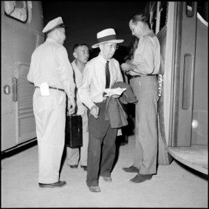 Gila River Relocation Center, Rivers, Arizona. After final checkings are completed, evacuees are an . . . - NARA - 539851
