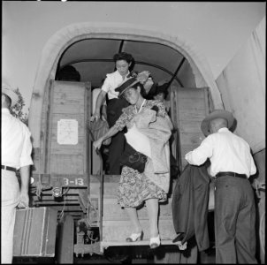 Gila River Relocation Center, Rivers, Arizona. Center residents arrive by truck to board bus for Ca . . . - NARA - 539845