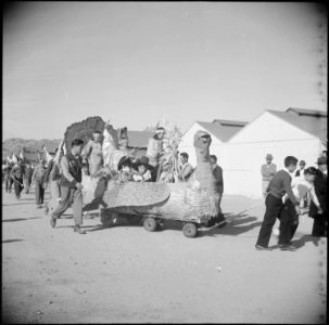 Gila River Relocation Center, Rivers, Arizona. Evacuee children riding in one of the floats in the . . . - NARA - 538594