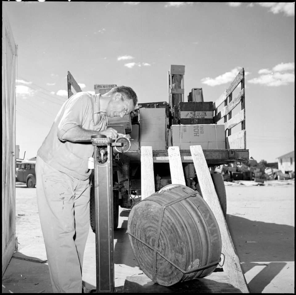 Gila River Relocation Center, Rivers, Arizona. Property officer weighing freight shipment. On Sept . . . - NARA - 539836