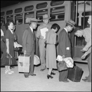 Gila River Relocation Center, Rivers, Arizona. Relocators being checked by Leave Officers before bo . . . - NARA - 539829