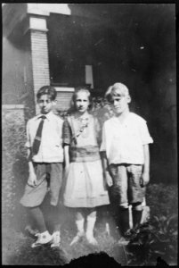 Gerald R. Ford, Jr., Poses with His Cousins Gardner and Adele James on the Front Lawn of an Unidentified House - NARA - 186941 photo