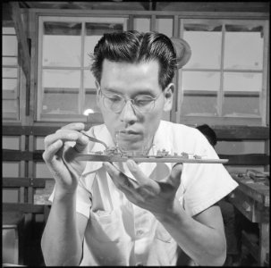 Gila River Relocation Center, Rivers, Arizona. Tadashi Imai, former Los Angeles fruit stand worker, . . . - NARA - 537096