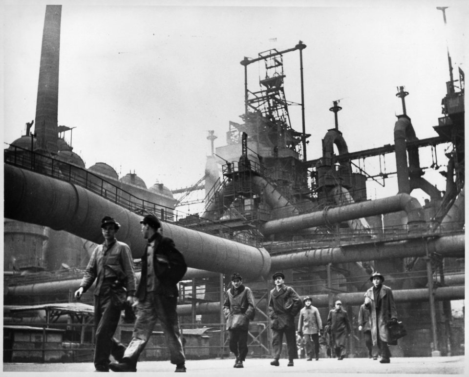 Germany. (Workers leaving factory.) - NARA - 541699