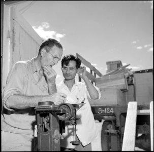 Gila River Relocation Center, Rivers, Arizona. Property officer figuring freight weight prior to be . . . - NARA - 539837