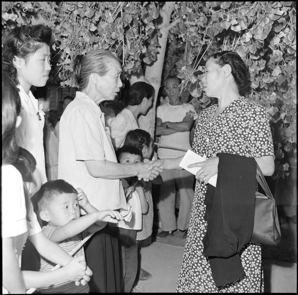 Gila River Relocation Center, Rivers, Arizona. Goodbyes are said as friends and neighbors again s . . . - NARA - 539843