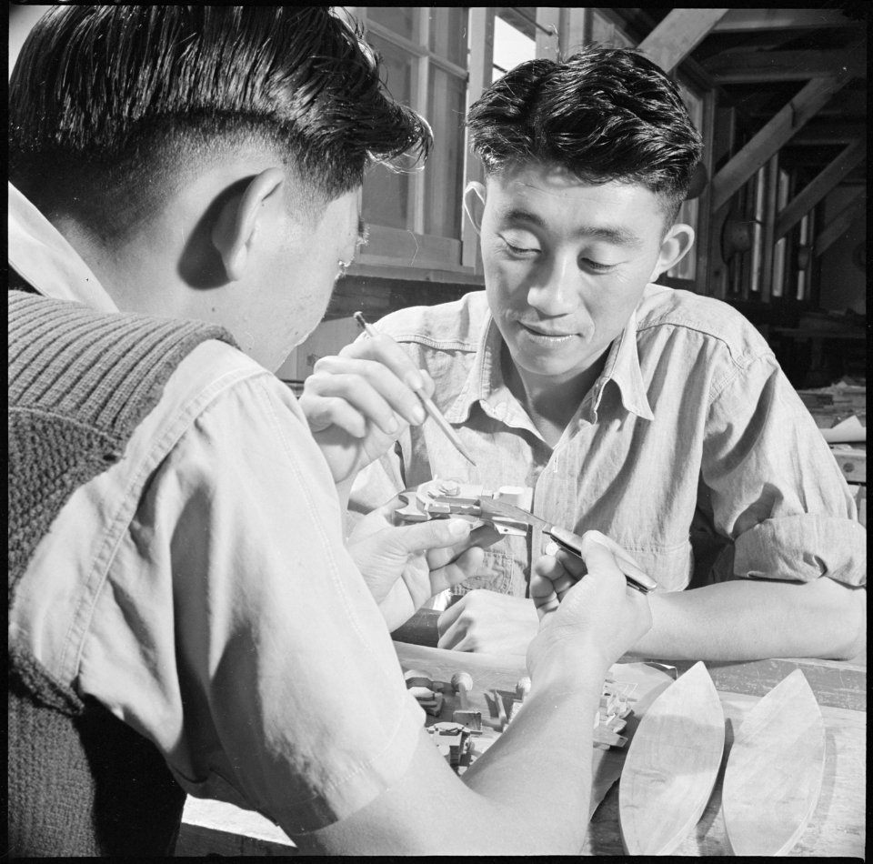 Gila River Relocation Center, Rivers, Arizona. Roy Katsura and Haruo Yoshimoto (L. to R.) check the . . . - NARA - 537095