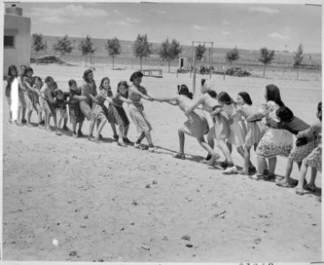 Girls at Isleta Day School in a tug of war, Albuquerque, New Mexico, 1940 - NARA - 519167 photo
