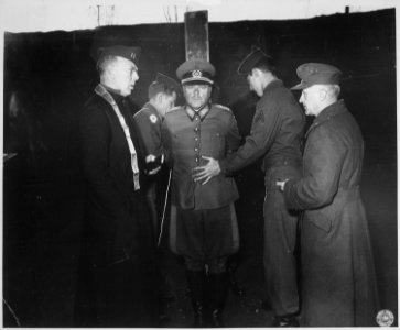 German General Anton Dostler is tied to a stake before his execution by a firing squad in the Aversa stockade. The... - NARA - 531326