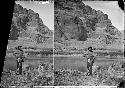 Glen Canyon. John F. Steward with his gun, pick and shoulder bag (map case^) and wearing the usual wide brim felt... - NARA - 517872