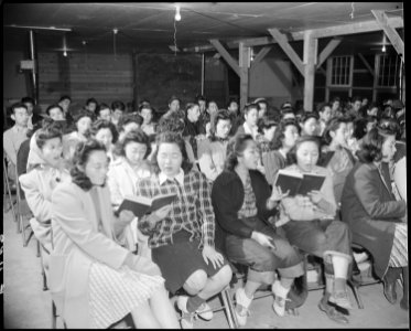 Granada Relocation Center, Amache, Colorado. A choral group of 200 volunteer voices practicing for . . . - NARA - 539029