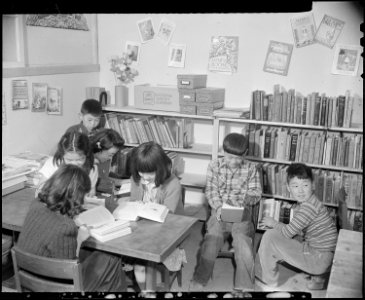 Granada Relocation Center, Amache, Colorado. A corner of the grade school library in one of the barracks. - NARA - 539037