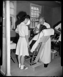 Granada Relocation Center, Amache, Colorado. A former Los Angeles dentist continues to perform the . . . - NARA - 539044
