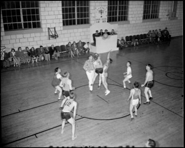 Granada Relocation Center, Amache, Colorado. A hotly contested basket ball game between the Granada . . . - NARA - 539058