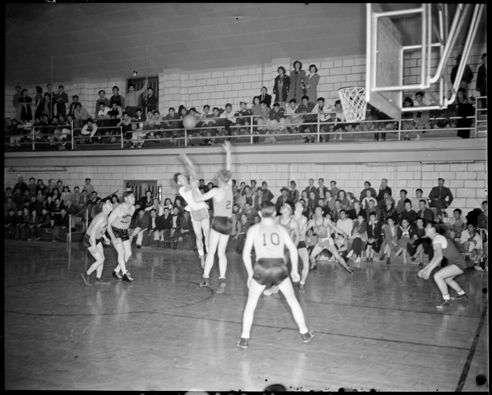 Granada Relocation Center, Amache, Colorado. A hotly contested basket ball game between the Granada . . . - NARA - 539057