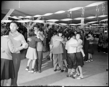 Granada Relocation Center, Amache, Colorado. A regular Saturday evening dance at Terry Hall, a mess . . . - NARA - 539062