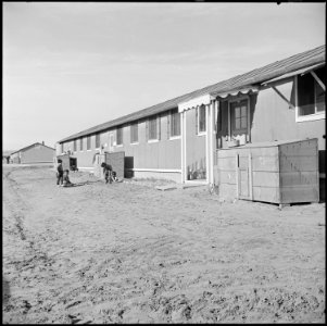 Granada Relocation Center, Amache, Colorado. A typical barracks building resident of the first apar . . . - NARA - 539118