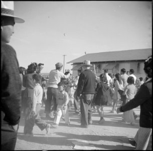 Gila River Relocation Center, Rivers, Arizona. Some of the spectators who witnessed the Harvest Fes . . . - NARA - 538590 photo