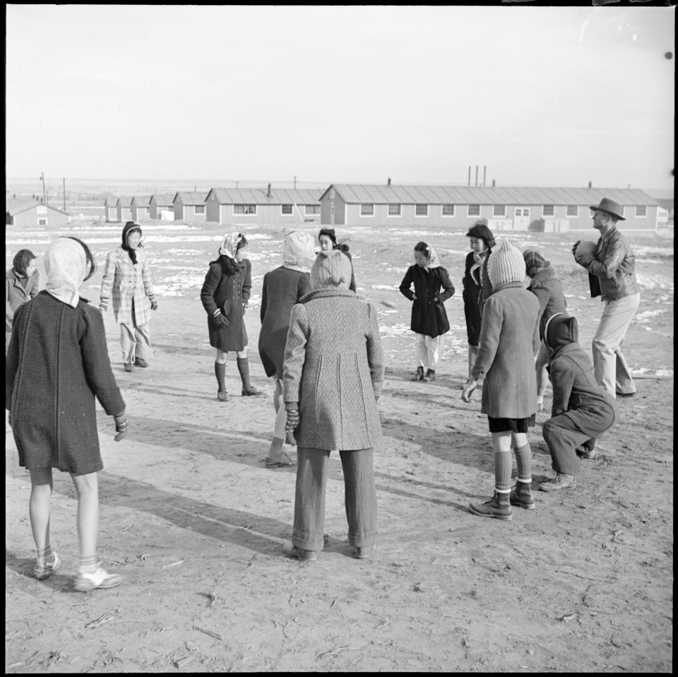 Granada Relocation Center, Amache, Colorado. A recreation leader conducts games on the girls play g . . . - NARA - 539110