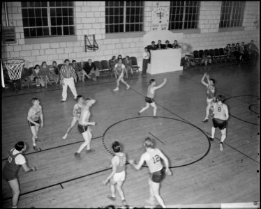 Granada Relocation Center, Amache, Colorado. A hotly contested basket ball game between the Granada . . . - NARA - 539059