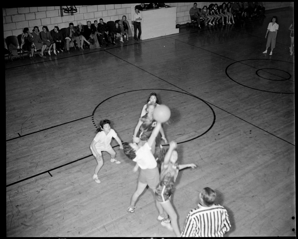 Granada Relocation Center, Amache, Colorado. A tense moment in a basket ball game between the Grana . . . - NARA - 539060