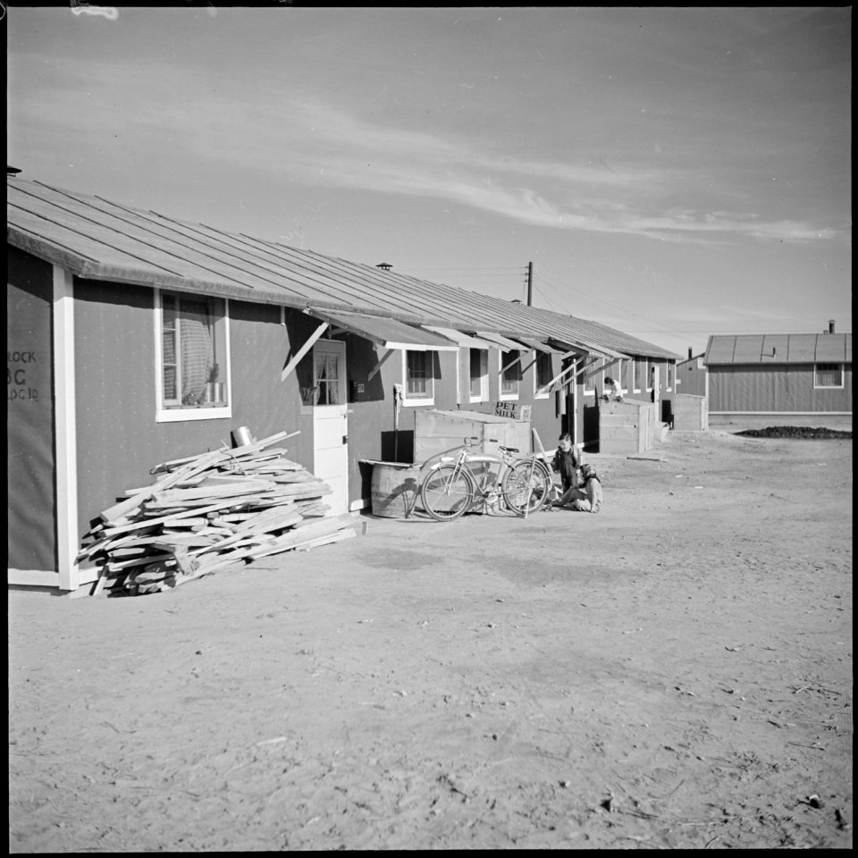 Granada Relocation Center, Amache, Colorado. A typical barracks building. The weather canopies ove . . . - NARA - 539073