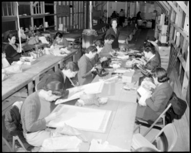 Granada Relocation Center, Amache, Colorado. An adult education class in fine needlework. The teac . . . - NARA - 539024