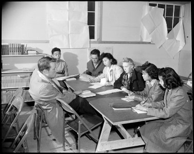 Granada Relocation Center, Amache, Colorado. An evening class in the adult education section who ar . . . - NARA - 539051
