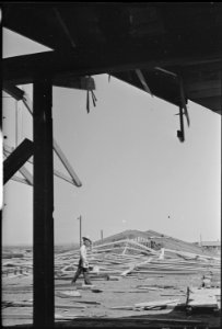 Granada Relocation Center, Amache, Colorado. Community store under construction damaged by storm. - NARA - 537234
