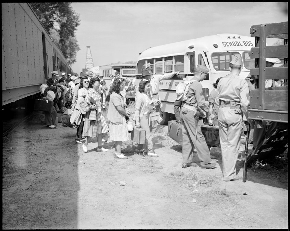Granada Relocation Center, Amache, Colorado. Evacuees leaving the railroad train at the Granada sta . . . - NARA - 538742