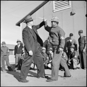 Granada Relocation Center, Amache, Colorado. Chief of Internal Security, Tomlinson, demonstrates to . . . - NARA - 539104