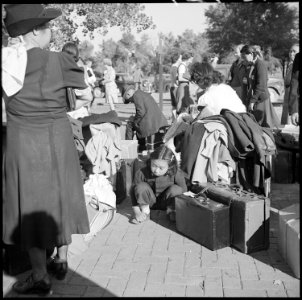 Granada Relocation Center, Amache, Colorado. Children guard the family possessions while awaiting t . . . - NARA - 539945