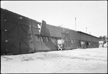 Granada Relocation Center, Amache, Colorado. Exterior view of Granada motor pool garage after storm . . . - NARA - 539614