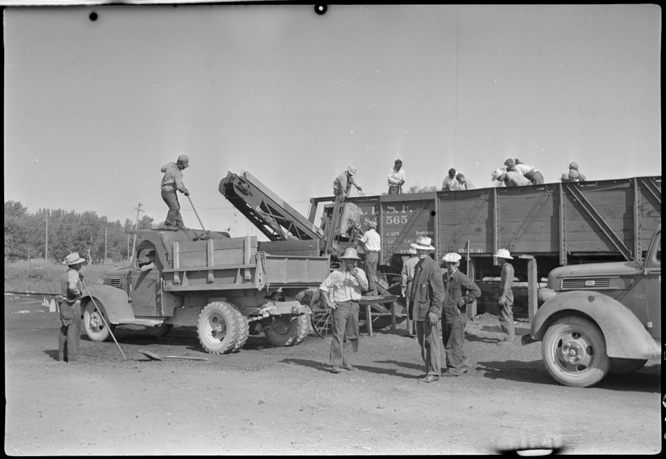 Granada Relocation Center, Amache, Colorado. Coal loading machine in operation at Granada Relocatio . . . - NARA - 537314
