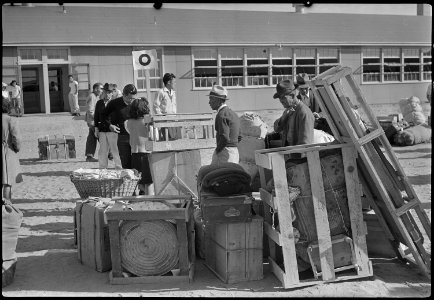Granada Relocation Center, Amache, Colorado. Check baggage was sorted alphabetically by family name. - NARA - 537365