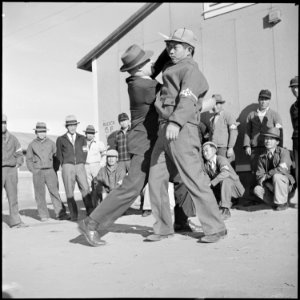 Granada Relocation Center, Amache, Colorado. Chief of Internal Security, Tomlinson, demonstrates to . . . - NARA - 539103