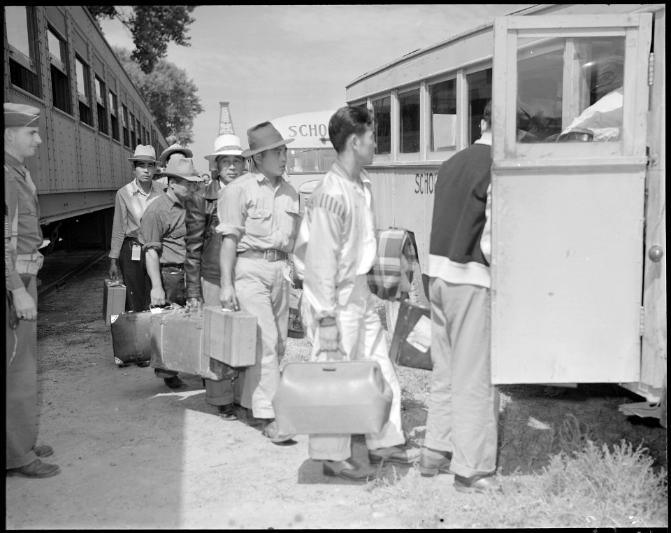 Granada Relocation Center, Amache, Colorado. First evacuees to arrive at the Granada railroad stati . . . - NARA - 538727