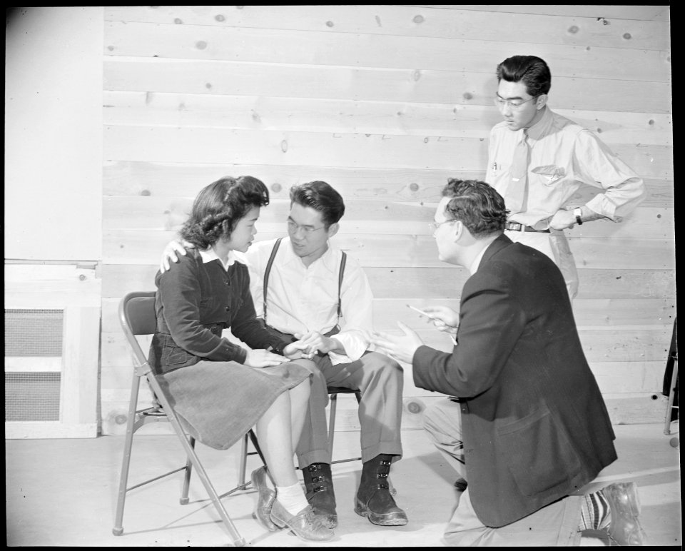 Granada Relocation Center, Amache, Colorado. Drama instructor, Derlan, coaches three drama students . . . - NARA - 539025
