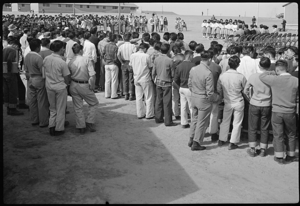 Granada Relocation Center, Amache, Colorado. High school students at outdoor assembly. - NARA - 537171