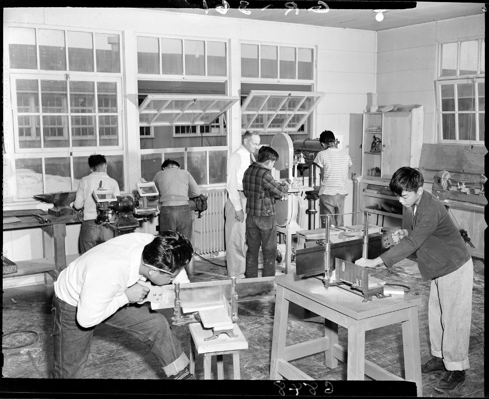 Granada Relocation Center, Amache, Colorado. Leo W. Kraus and his high school woodworking shop. - NARA - 539607