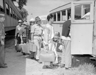 Granada Relocation Center, Amache, Colorado. First evacuees to arrive at the Granada railroad stati . . . - NARA - 538727