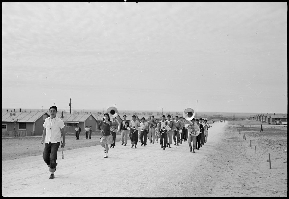 Granada Relocation Center, Amache, Colorado. High school band marching. - NARA - 537174