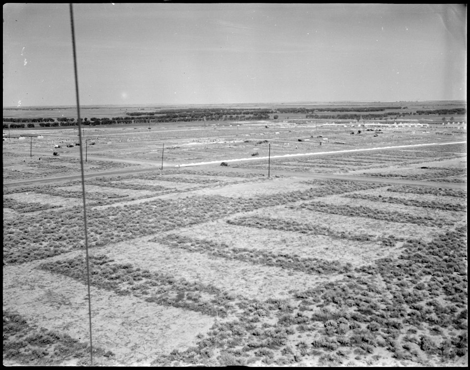 Granada Relocation Center, Amache, Colorado. Looking northwest over a section of the relocation cen . . . - NARA - 538752